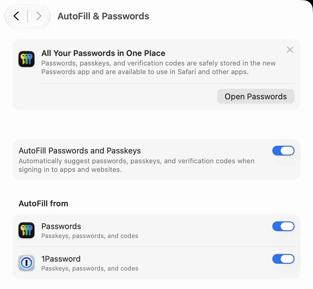 The AutoFill & Passwords screen in System Settings. AutoFill Passwords and Passkeys is on, and under AutoFill from, Passwords and 1Password are both turned on