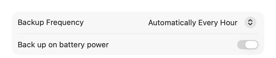 The Options window. Backup Frequency is set to Automatically Every Hour, and below it is the Back up on battery power switch, turned on