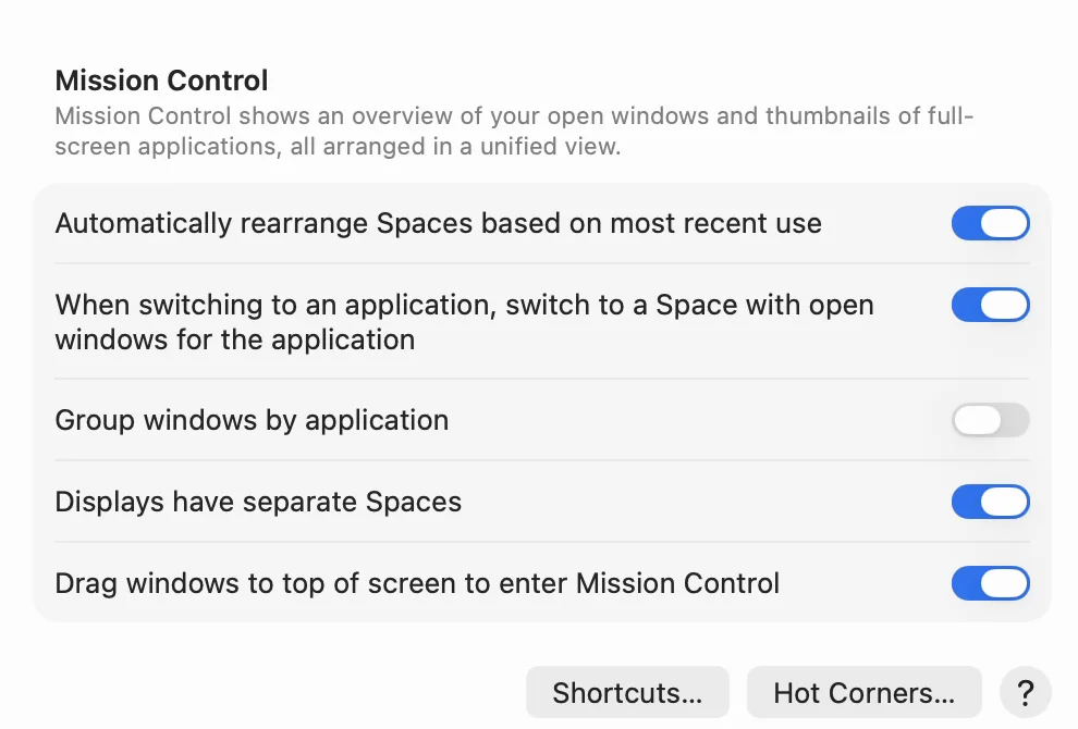 The Mission Control section of Desktop & Dock settings in English. Automatically rearrange Spaces based on most recent use is turned on