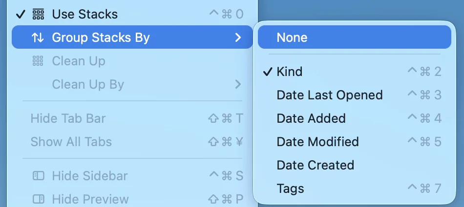 Group Stacks By open in the View menu, listing None, Kind, Date Last Opened, Date Added, Date Modified, Date Created and Tags, with a checkmark next to Kind