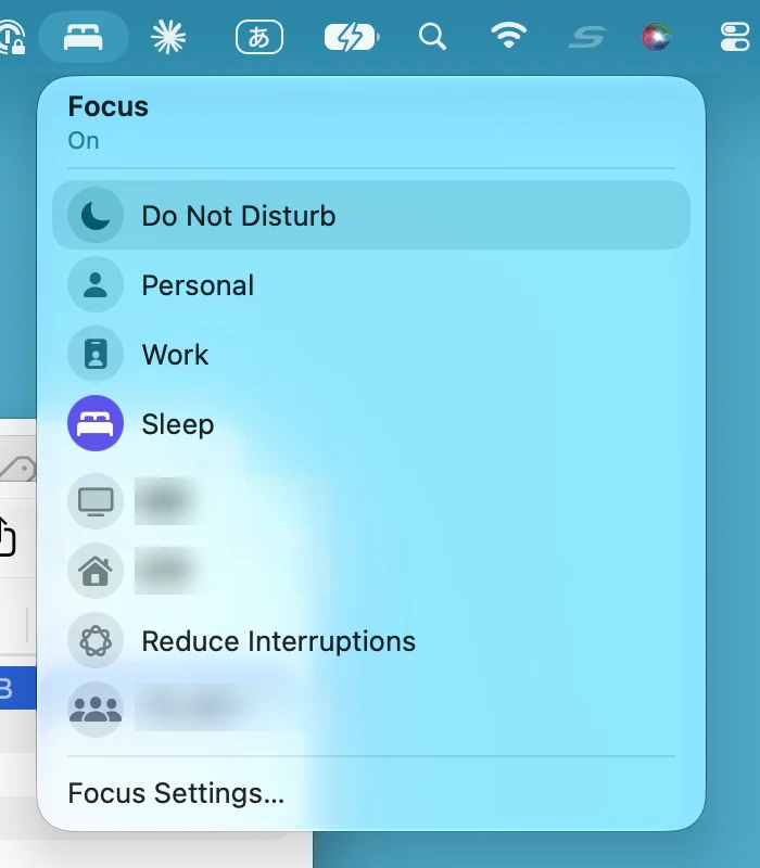 The Focus list in Control Center, headed Focus, On. From the top: Do Not Disturb (highlighted under the pointer), Personal, Work, Sleep (its icon is purple because it is on), two custom Focus modes with blurred names, Reduce Interruptions, and one more blurred name. At the bottom, Focus Settings…