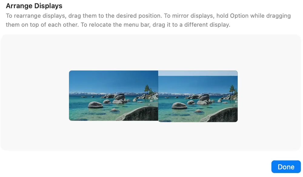 The Arrange Displays window. Two lines of instructions at the top, and below them two pictures of screens side by side, with a light strip along the top of the right one