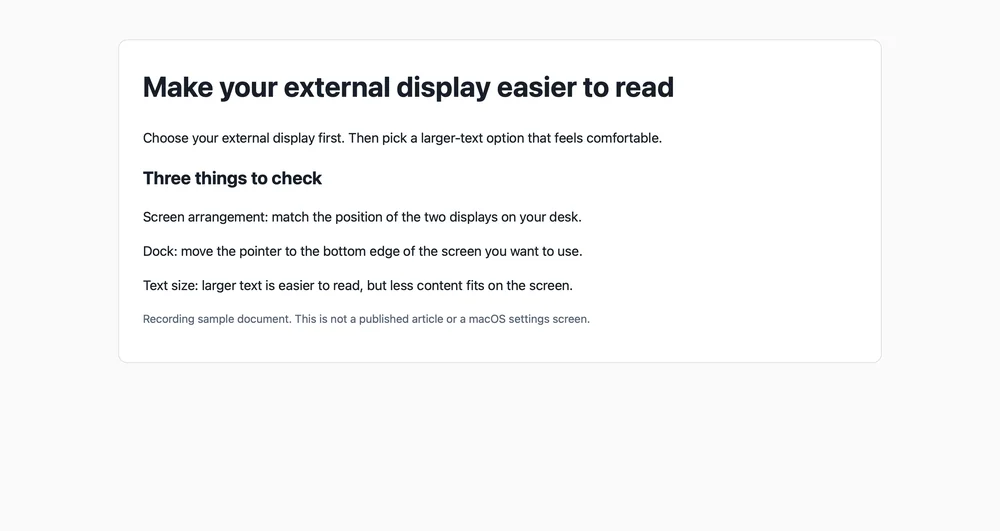 A sample page open on the external display, with a heading and short lines of small text and empty space below